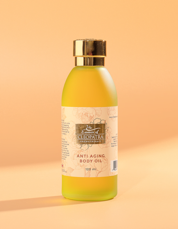 a bottle of ANTI AGING BODY OIL on a yellow background.