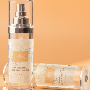 a bottle of HYDRATING CLEANSING OIL on an orange background.